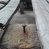 nail on wood image